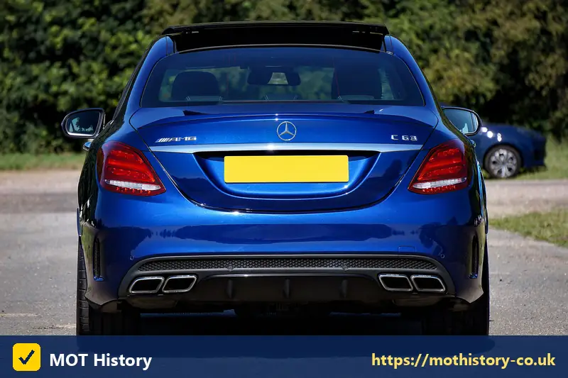 Rear of a blue saloon with a yellow number plate - sorn car insurance