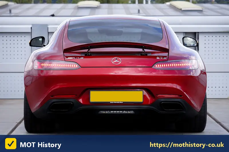 Rear of a red sports car with a yellow number plate - sorn status check