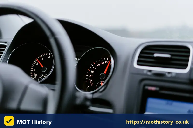 Car dashboard showing the speedometer and odometer - vehicle registration certificate