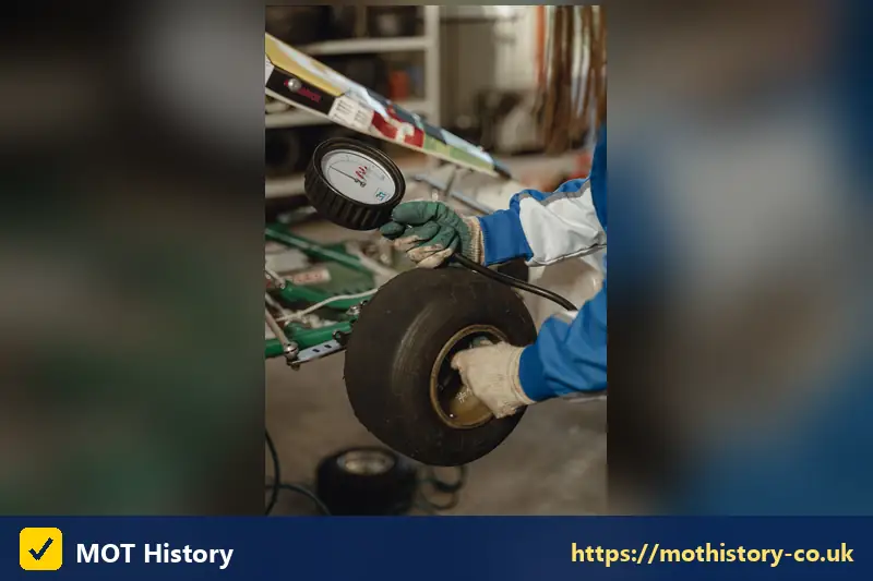Tyre pressure gauge being used on a wheel - why is my mot not showing online