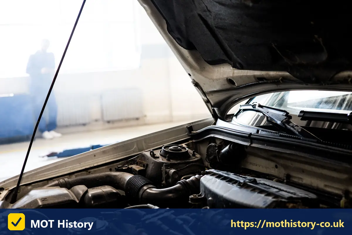 Engine bay seen from the front of a car with the bonnet open - check engine check